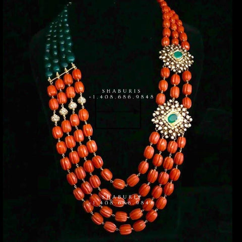 Handmade unique coral necklace. Made with orange hand carved beads and gold  crystal beads